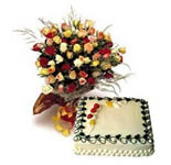 Sumptouus 1 kg pinapple cake with cheerful lovely mix colour roses hand tied in a lovely prim crepe with a flowing bow.